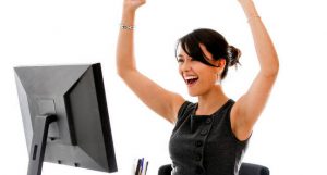 happy woman at desk 300x161 - happy_woman_at_desk.jpeg