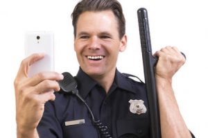 shutterstock police selfie 300x199 - shutterstock_police_selfie.jpeg